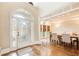 Open floor plan with hardwood floors, a dining area, and a view of the front yard at 1900 Denton Walk Ct, Marietta, GA 30062