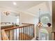Elegant foyer showcasing hardwood floors, a decorative chandelier, and a staircase at 1900 Denton Walk Ct, Marietta, GA 30062