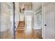 Inviting foyer with hardwood floors, a staircase, and an open view to the living space at 1900 Denton Walk Ct, Marietta, GA 30062
