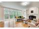 Inviting living room featuring a fireplace, large windows, and comfortable seating at 1900 Denton Walk Ct, Marietta, GA 30062