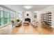 Spacious living room featuring a fireplace, large windows, and hardwood floors at 1900 Denton Walk Ct, Marietta, GA 30062