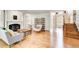 Open living room with hardwood floors, fireplace, and staircase at 1900 Denton Walk Ct, Marietta, GA 30062