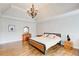 Expansive main bedroom with a chandelier, hardwood floors, and a sitting area at 1900 Denton Walk Ct, Marietta, GA 30062