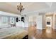 Large main bedroom featuring hardwood floors, a chandelier, and natural light at 1900 Denton Walk Ct, Marietta, GA 30062