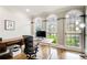 Home office with large windows, natural light, and hardwood floors at 1900 Denton Walk Ct, Marietta, GA 30062