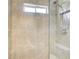 Shower with gray tiling, a shower head and a built in nook above the toilet at 1900 Denton Walk Ct, Marietta, GA 30062