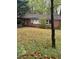 Cozy one-story brick house featuring a covered porch and a well-maintained lawn with mature trees at 2667 Plantation Dr, Atlanta, GA 30344