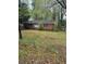 Charming one-story brick house with a porch surrounded by lush green foliage and a spacious front yard at 2667 Plantation Dr, Atlanta, GA 30344