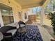 Relaxing covered patio with comfortable seating, offering an ideal spot for outdoor enjoyment at 5576 Rockfern Drive, Lilburn, GA 30047