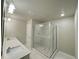 Bathroom featuring double sink vanity and glass enclosed shower at 5576 Rockfern Drive, Lilburn, GA 30047