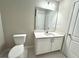 Bathroom featuring a vanity and a toilet at 5576 Rockfern Drive, Lilburn, GA 30047