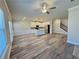 Open-concept living space featuring a modern kitchen, stainless steel appliances, and luxury vinyl flooring at 5576 Rockfern Drive, Lilburn, GA 30047