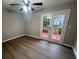 Bedroom with hardwood floors and a patio door leading to the outside at 5961 Sherwood Trce, Stonecrest, GA 30038