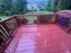 Spacious outdoor deck with wood railing offers a tranquil spot for relaxation and entertaining at 5961 Sherwood Trce, Stonecrest, GA 30038
