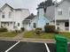 Charming townhouse exterior with a well-maintained front lawn at 5961 Sherwood Trce, Stonecrest, GA 30038
