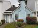 Charming two-story home with mature landscaping and light blue siding at 5961 Sherwood Trce, Stonecrest, GA 30038
