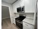 Updated kitchen featuring granite countertops and stainless steel appliances at 5961 Sherwood Trce, Stonecrest, GA 30038
