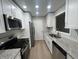 Updated kitchen featuring granite countertops and stainless steel appliances at 5961 Sherwood Trce, Stonecrest, GA 30038