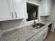 Updated kitchen featuring granite countertops and stainless steel appliances at 5961 Sherwood Trce, Stonecrest, GA 30038