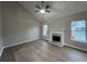 Bright living room with hardwood floors, vaulted ceiling, and marble fireplace at 5961 Sherwood Trce, Stonecrest, GA 30038