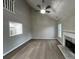 Spacious living room with high ceilings, modern fireplace, and view of the kitchen at 5961 Sherwood Trce, Stonecrest, GA 30038