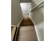 Stairs featuring wood-look flooring and railing at 5961 Sherwood Trce, Stonecrest, GA 30038
