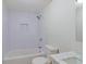 Bright bathroom with subway tile, a tub/shower combo, and a marble vanity top at 8304 Ephesus Church Rd, Villa Rica, GA 30180