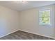 This cozy bedroom is illuminated by the natural light coming from the outdoor window at 8304 Ephesus Church Rd, Villa Rica, GA 30180
