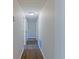Bright hallway with hardwood floors and neutral paint, providing seamless transition between rooms at 8304 Ephesus Church Rd, Villa Rica, GA 30180