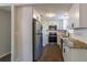 Beautiful kitchen with stainless steel appliances, granite countertops, and white cabinets at 8304 Ephesus Church Rd, Villa Rica, GA 30180