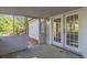 View of the outdoor space from the enclosed screened-in patio at 8304 Ephesus Church Rd, Villa Rica, GA 30180