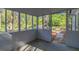 Enclosed screened porch with views of the backyard at 8304 Ephesus Church Rd, Villa Rica, GA 30180