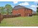 Spacious backyard featuring a well-maintained lawn and privacy fence at 2384 Allsborough Way, Dacula, GA 30019