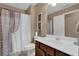 Bright bathroom featuring a vanity with a sink, a toilet, and a shower with a curtain at 2384 Allsborough Way, Dacula, GA 30019