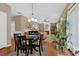 Open dining area with hardwood floors and a view into the living space at 2384 Allsborough Way, Dacula, GA 30019