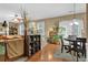 Bright dining area featuring hardwood floors and natural light at 2384 Allsborough Way, Dacula, GA 30019