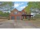 Charming two-story brick home with a well-maintained lawn and a two-car garage at 2384 Allsborough Way, Dacula, GA 30019