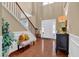 Inviting foyer with soaring ceilings, hardwood floors, and staircase at 2384 Allsborough Way, Dacula, GA 30019