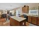 Well-equipped kitchen with a center island and hardwood floors at 2384 Allsborough Way, Dacula, GA 30019