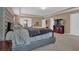 Large main bedroom featuring a king-size bed, neutral tones, and a view of a TV at 2384 Allsborough Way, Dacula, GA 30019