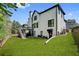 Two-story home with a manicured backyard, deck, and lush green lawn at 3085 Woodbridge Ln, Canton, GA 30114