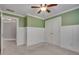 This bedroom has a window, carpeted floor, ceiling fan and white trim at 3085 Woodbridge Ln, Canton, GA 30114