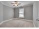 Neutral bedroom with a ceiling fan and a window, offering a calm space at 3085 Woodbridge Ln, Canton, GA 30114