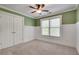 This bedroom has a window, carpeted floor, ceiling fan and white trim at 3085 Woodbridge Ln, Canton, GA 30114