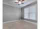 This bedroom has a window, carpeted floor, ceiling fan and white trim at 3085 Woodbridge Ln, Canton, GA 30114