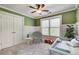 A decorated bedroom featuring gray walls, carpeted floor, ceiling fan and white trim at 3085 Woodbridge Ln, Canton, GA 30114
