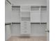 Walk-in closet with built-in shelving and drawers, offering ample storage space at 3085 Woodbridge Ln, Canton, GA 30114