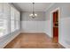 Dining room with ample natural light, wainscoting, and view into the kitchen at 3085 Woodbridge Ln, Canton, GA 30114