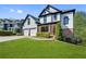 Beautiful two-story home featuring a well-manicured lawn and a two-car garage at 3085 Woodbridge Ln, Canton, GA 30114