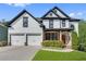 Charming two-story home with a well-kept lawn and a convenient two-car garage at 3085 Woodbridge Ln, Canton, GA 30114